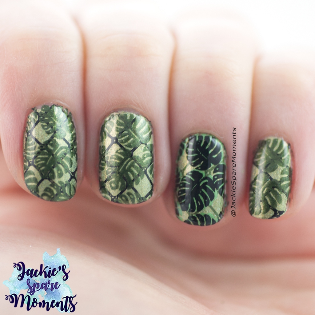 Nail art with stamped tropical leaves in green and black