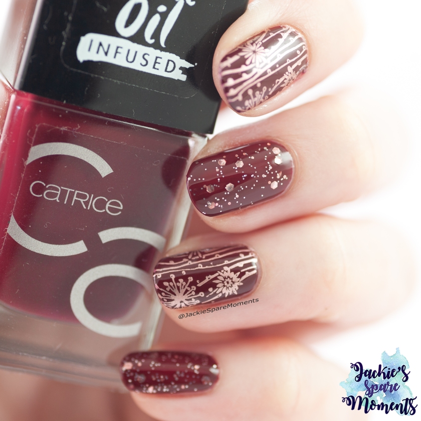 Catrice ICONails 82 Get Lost in Red You Love topped with Catrice Dream In 050 Sparkle Darling and stamping in rose gold.
